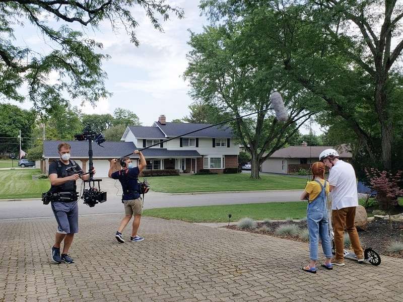 commercial-2_inpixio Eric Vucelich on set with boom mic and camera crew filming scene