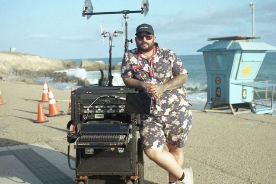 Audio supervisor Marcos Contreras with sound equipment on a beach