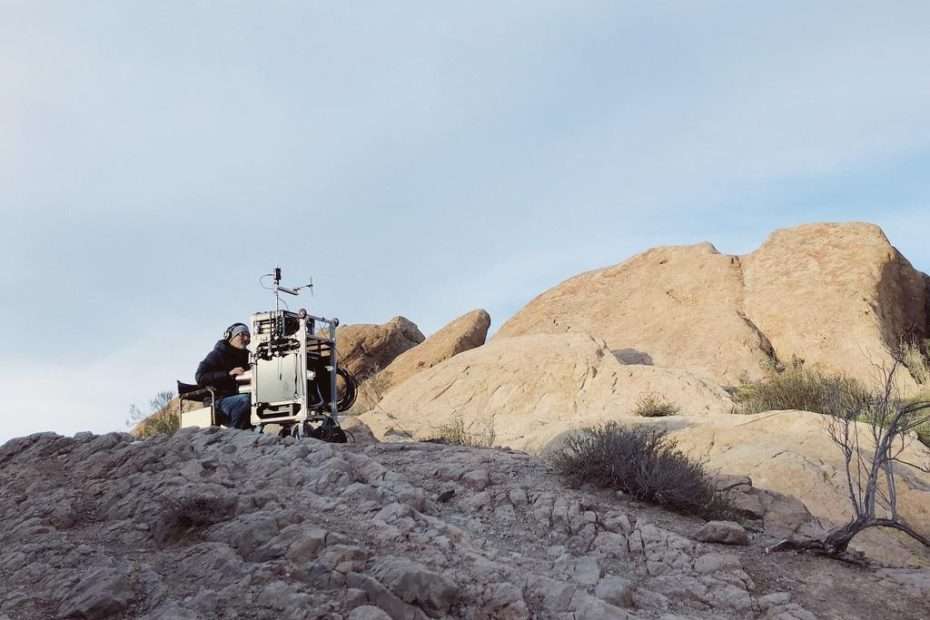 Jeffory Haddad with Lectrosonics gear in a rocky, outdoor setting.