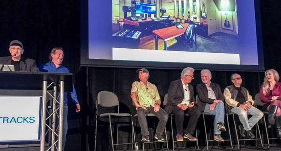 Panelists at NAMM TEC Tracks sessions with a studio image on screen.