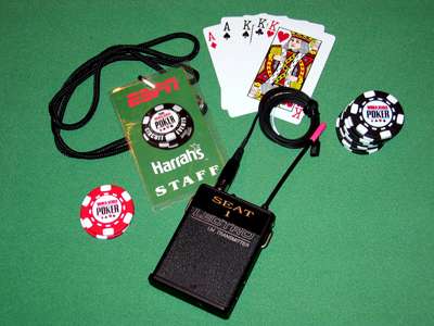 Lectrosonics transmitter for ESPN WSOP with poker chips, cards, and staff badge.
