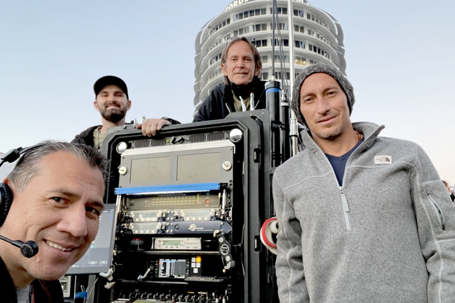 Juan Cisneros and crew with sound equipment in front of Capitol Records building.