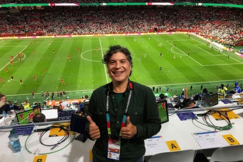 Man giving thumbs up at FIFA World Cup broadcast with Alumbrar Sound Services gear
