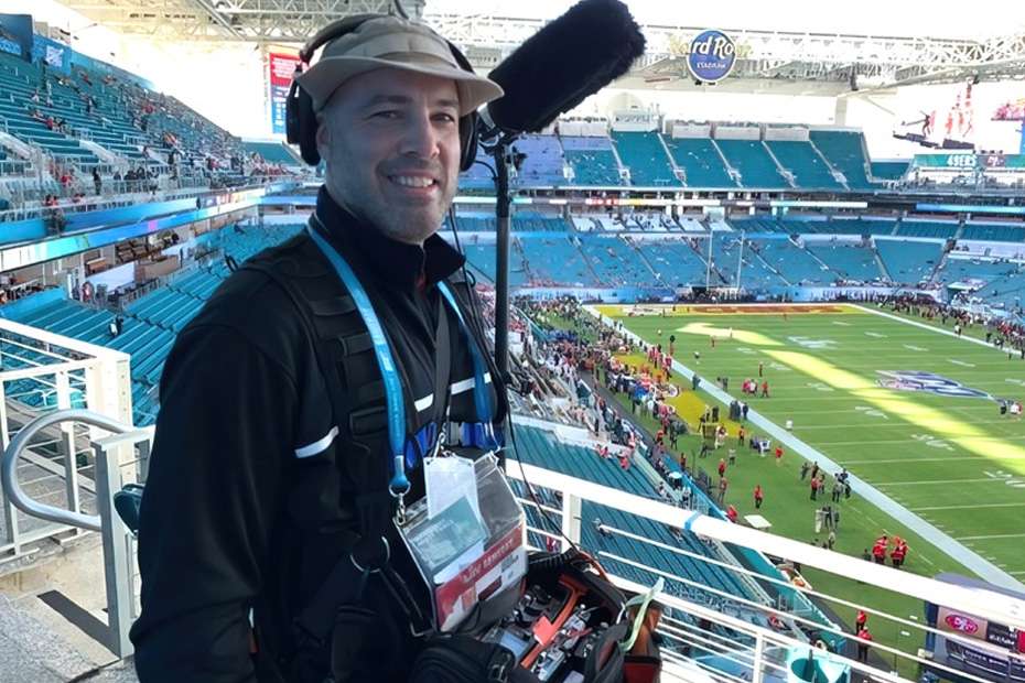 Greg Murphy with Lectrosonics gear at a stadium event, ready for action.