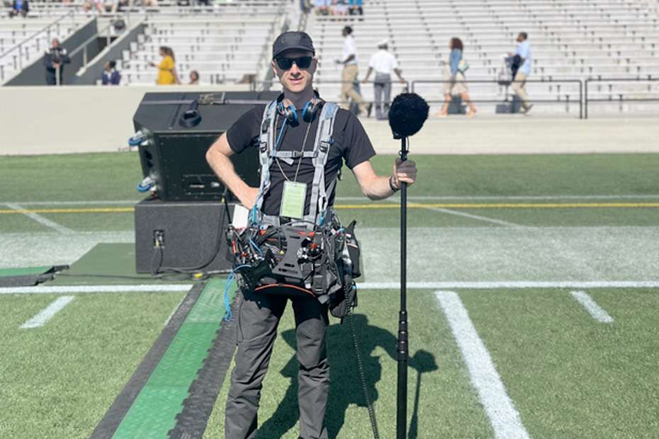 Jordan Moser with Waverider Audio gear, ready for a broadcast shoot.