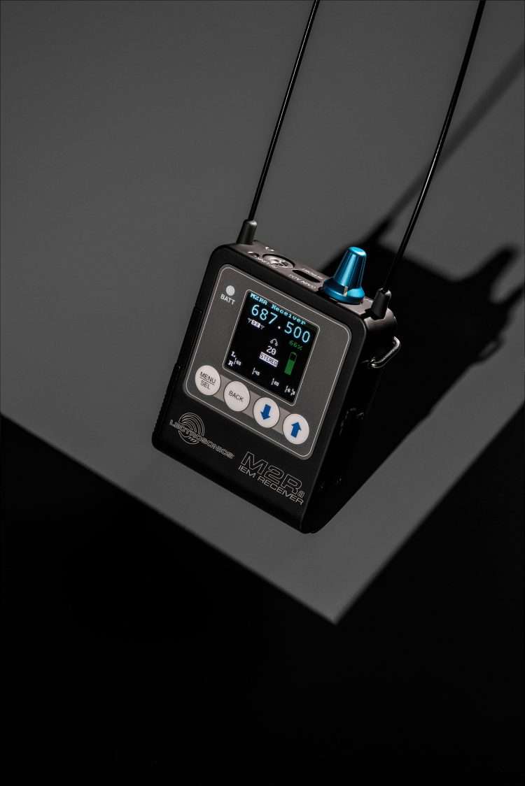M2Ra IEM receiver with blue antenna knob and illuminated display.