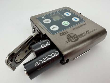 Lectrosonics DBu transmitter with two AA batteries inserted: eneloop pro and one other