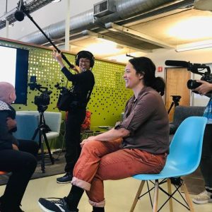 Shuling-Yong3 Shuling Yong filming with Lectrosonics wireless systems, capturing social change stories.
